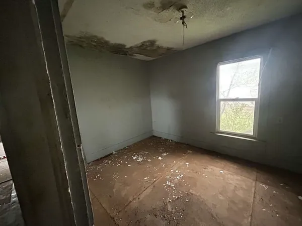 a view of an empty room with a window