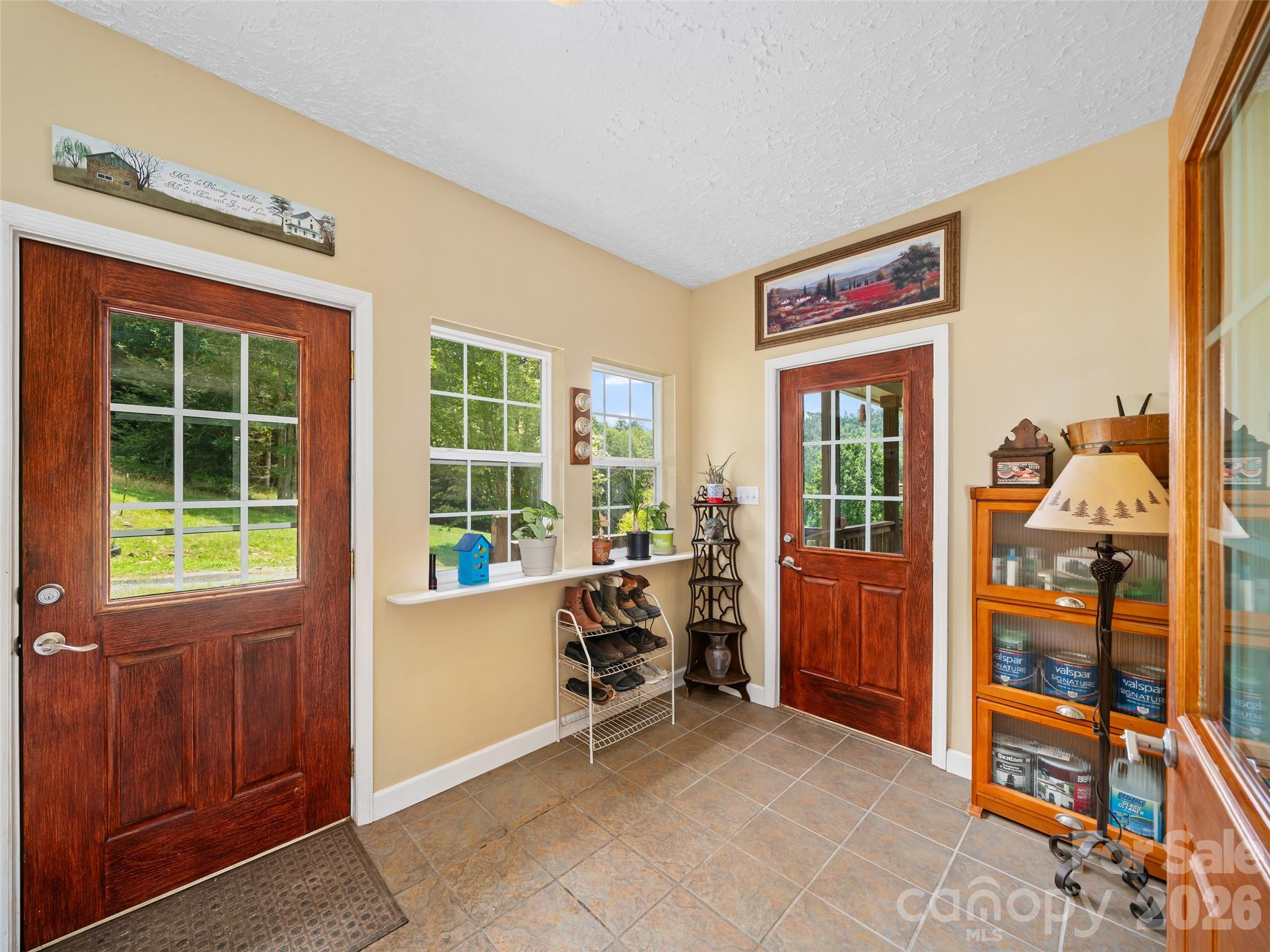 2216 Beans Creek Road Bakersville, NC 28705 - Photo 12 of 39 a view of a livingroom with furniture and windows