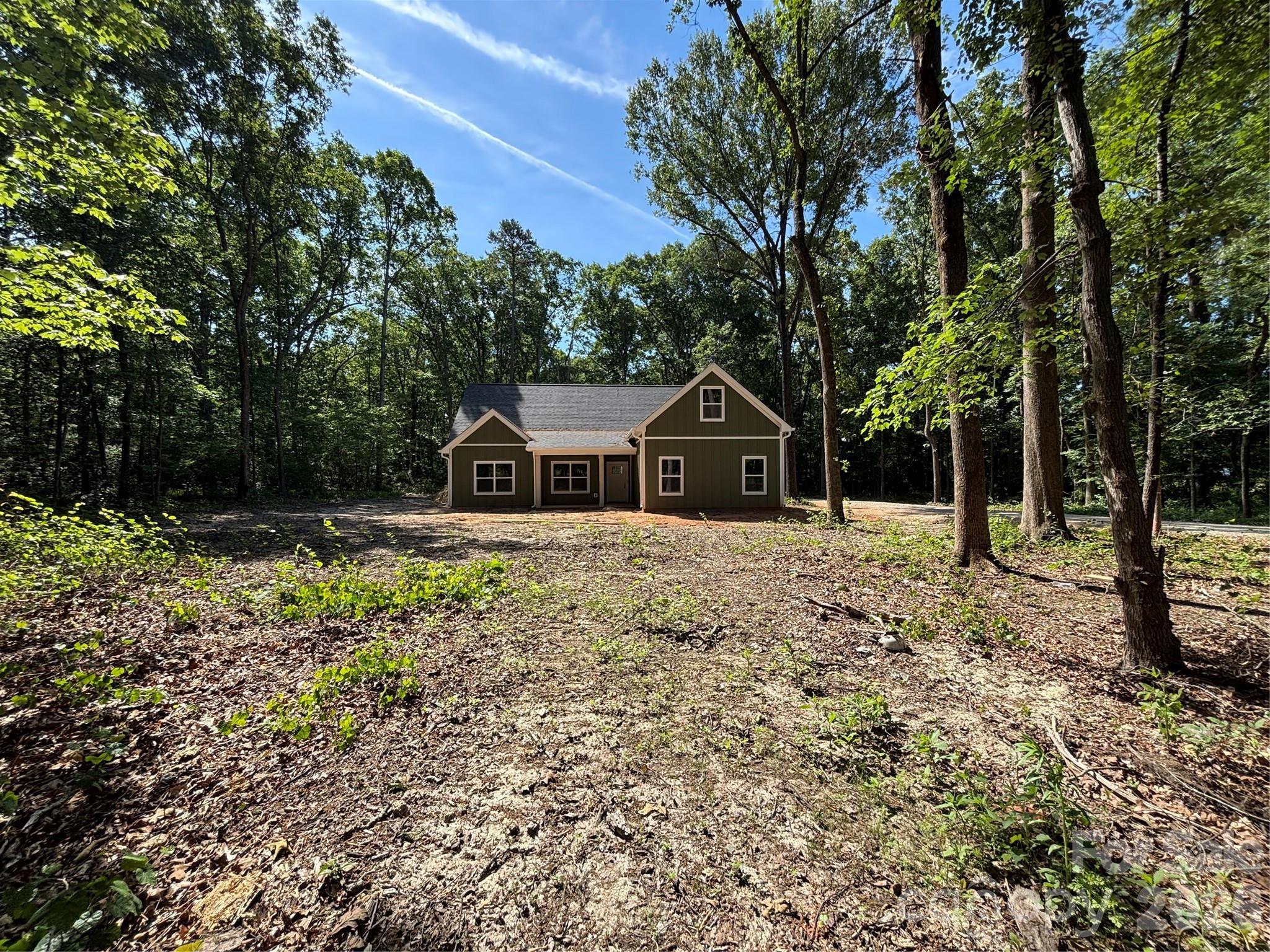 1818 New Salem Road Monroe, NC 28110 - Photo 4 of 8 a front view of a house with a yard