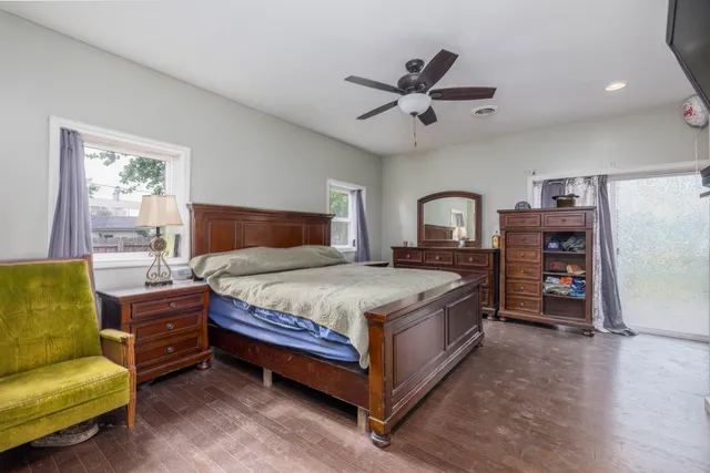 a bedroom with a bed furniture and a window