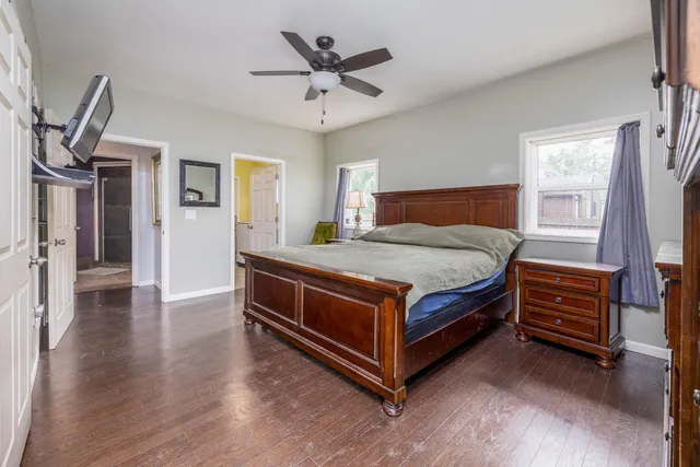a bedroom with a bed and a chandelier