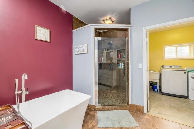 a room with a table and a refrigerator