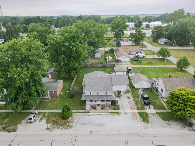 an aerial view of a house with a garden