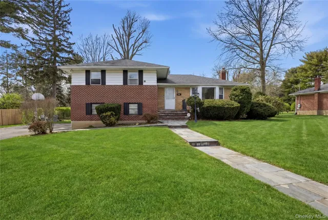 an aerial view of town with residential house and mountain view