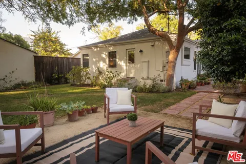 a patio with table and chairs
