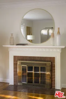a kitchen with a sink and a mirror