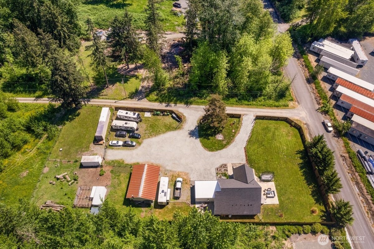 26709 Entwhistle Road East Buckley, WA 98321 - Photo 37 of 40 an aerial view of a house with swimming pool and large trees