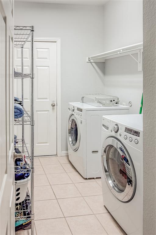 7253 Bianca Lane Plano, TX 75093 - Photo 12 of 18 a utility room with dryer and washer
