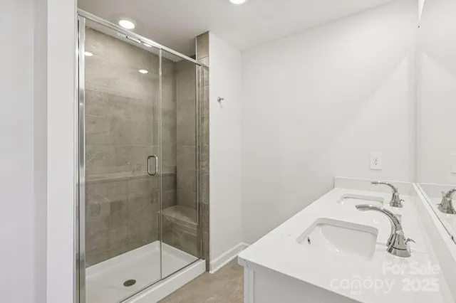 a bathroom with a sink and shower