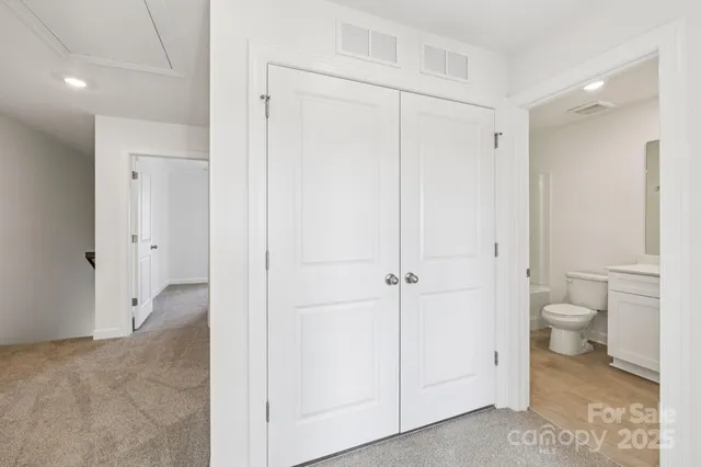 a bathroom view of a toilet and a sink