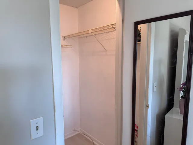 a bathroom with a glass shower door