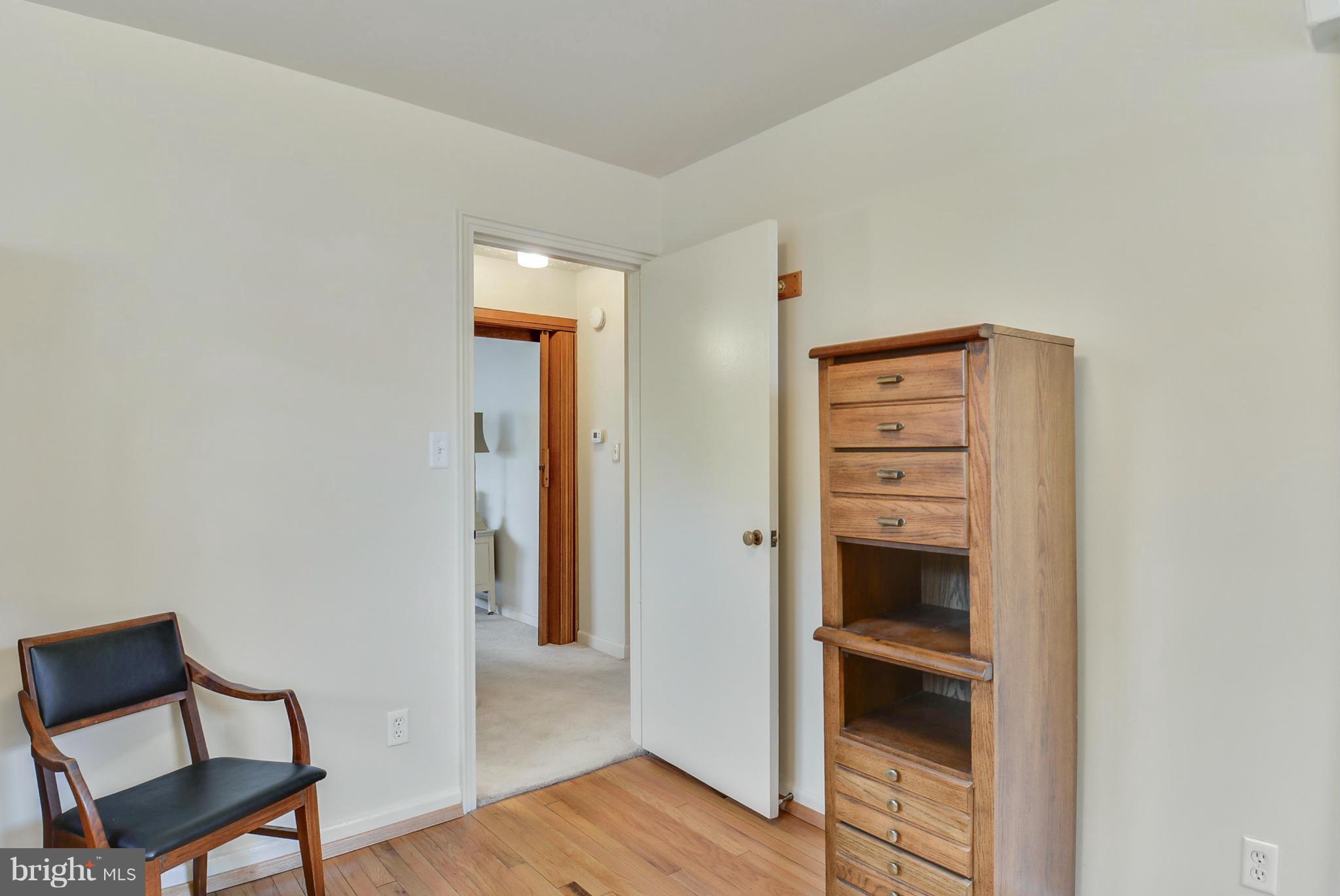 12613 Epping Road Silver Spring, MD 20906 - Photo 22 of 29 a view of room with walk in closet and wooden floor