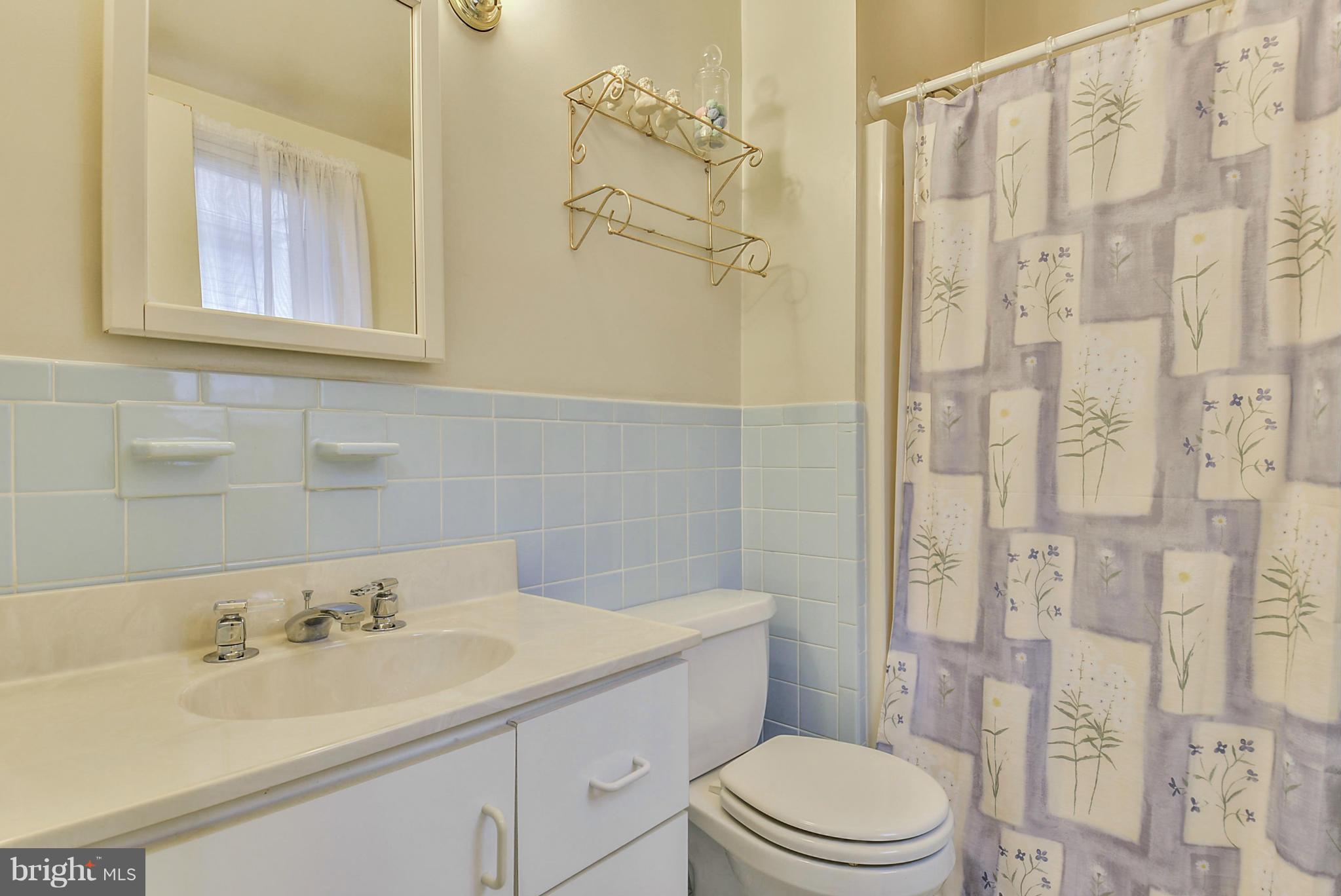 12613 Epping Road Silver Spring, MD 20906 - Photo 25 of 29 a bathroom with a sink a toilet and shower