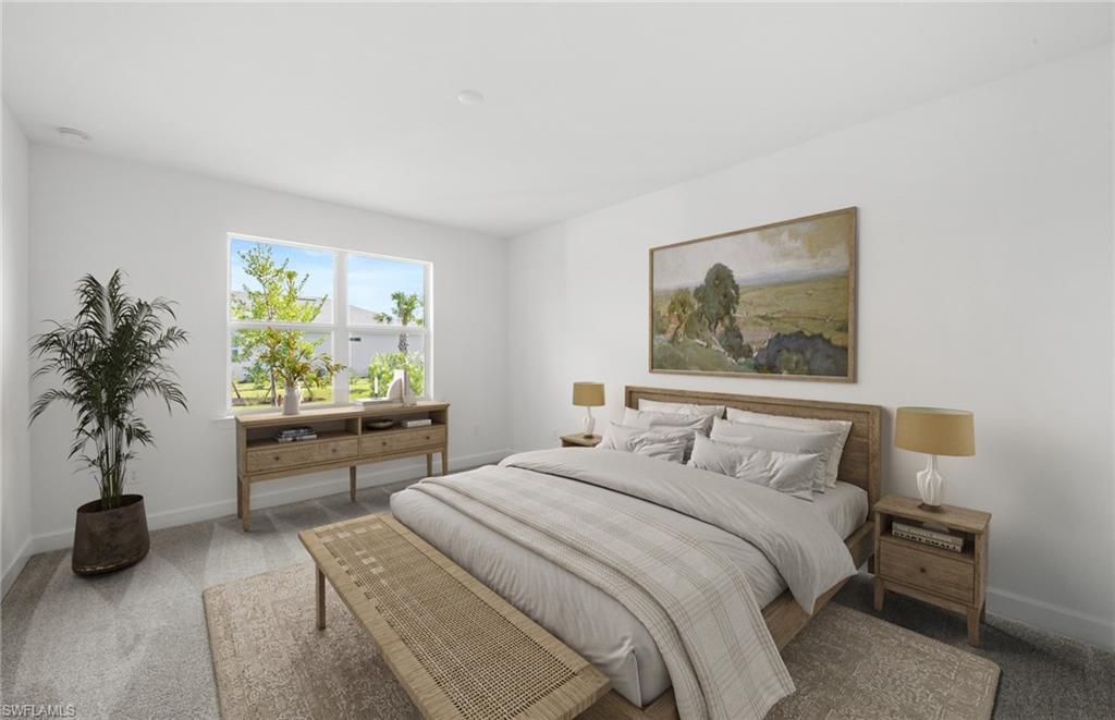 15629 Northridge Road Punta Gorda, FL 33982 - Photo 12 of 26 a bedroom with a large bed and a potted plant