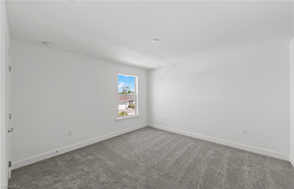 15629 Northridge Road Punta Gorda, FL 33982 - Photo 18 of 26 an empty room with windows