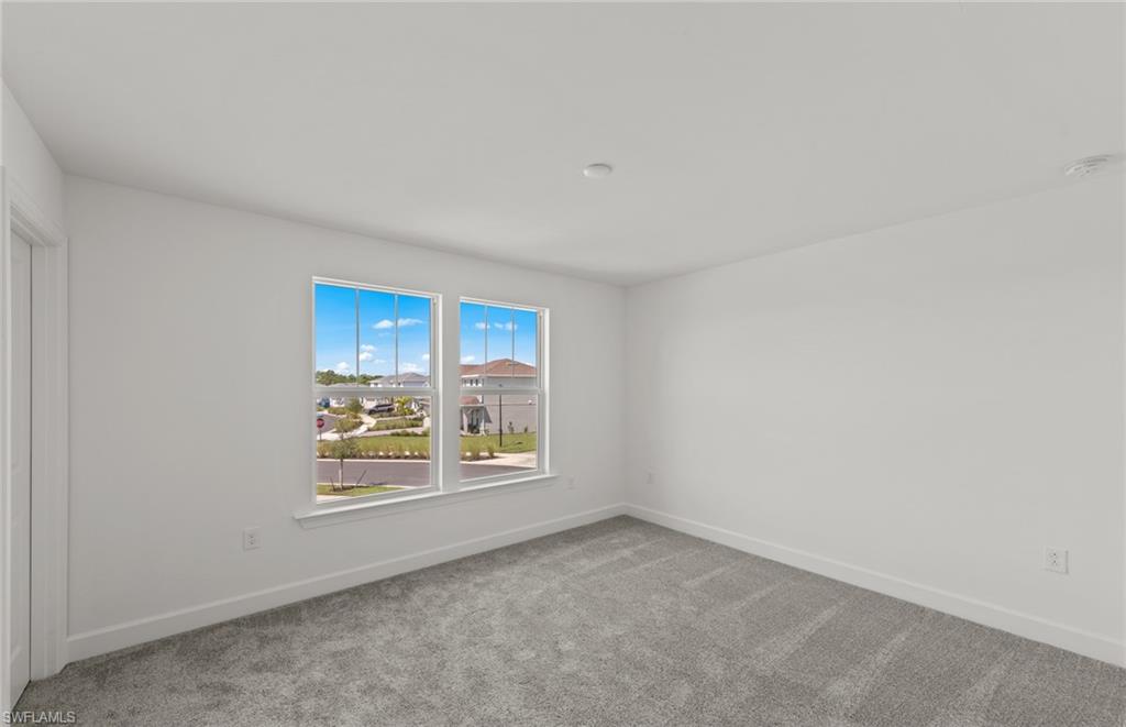 15629 Northridge Road Punta Gorda, FL 33982 - Photo 19 of 26 an empty room with windows