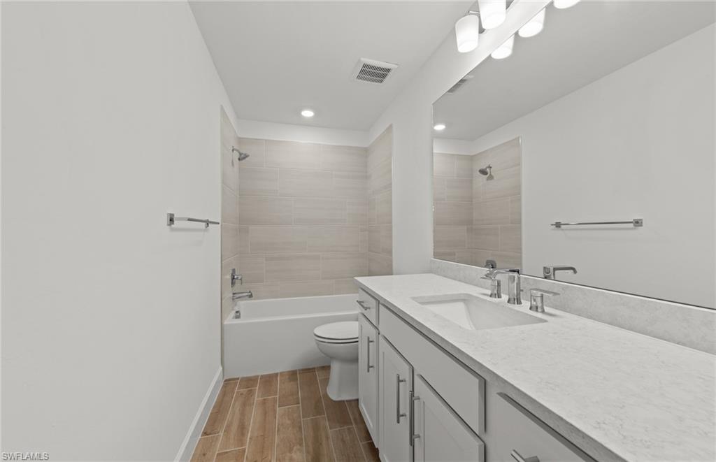 15629 Northridge Road Punta Gorda, FL 33982 - Photo 20 of 26 a bathroom with a sink a toilet a shower and a mirror