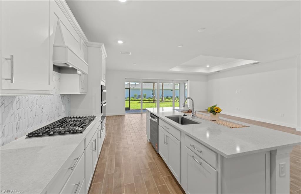 15629 Northridge Road Punta Gorda, FL 33982 - Photo 7 of 26 a kitchen with stainless steel appliances a sink a stove and a cabinets