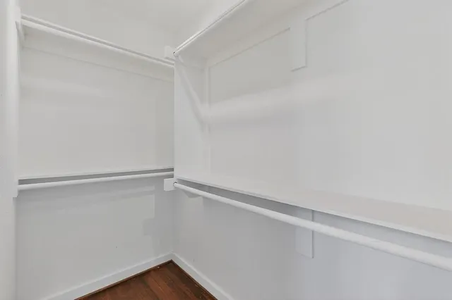 a view of an empty walk in closet