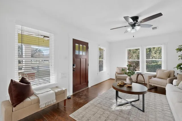 a living room with furniture and a window