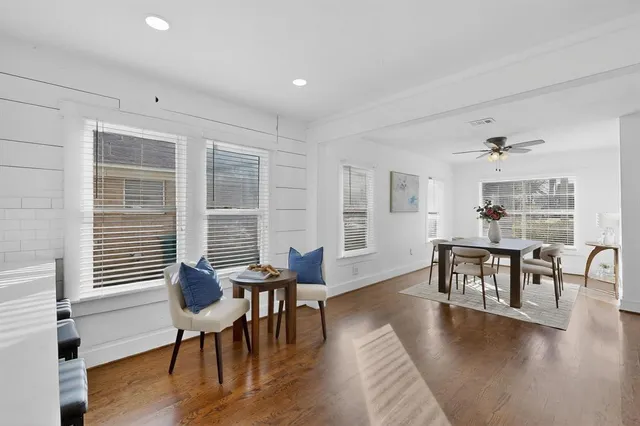 a view of a dining room with furniture window and wooden floor