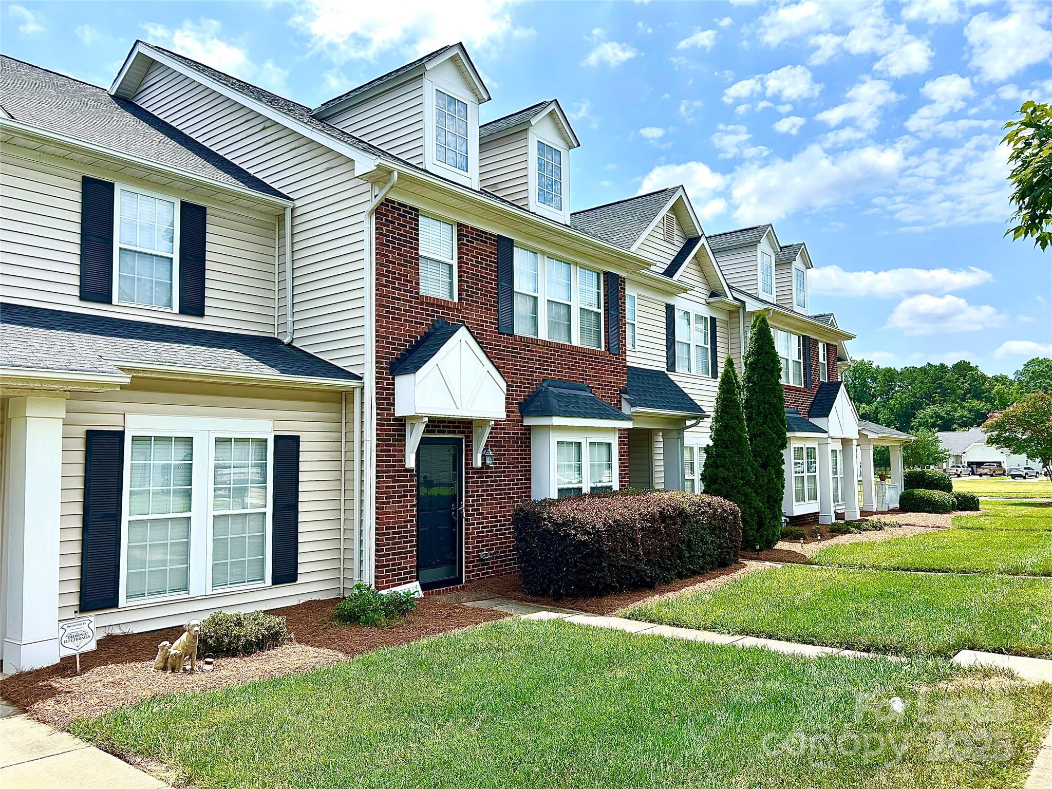 2049 Twilight Lane Monroe, NC 28110 - Photo 1 of 17 a front view of a house with a yard