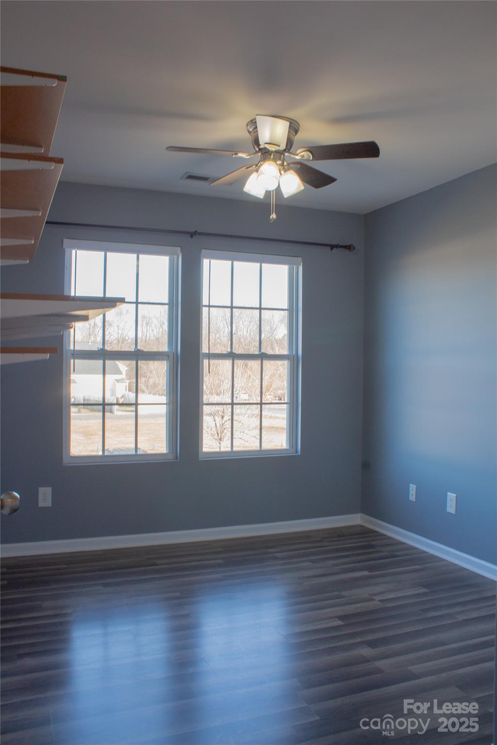 2049 Twilight Lane Monroe, NC 28110 - Photo 11 of 17 a view of an empty room with wooden floor and a window