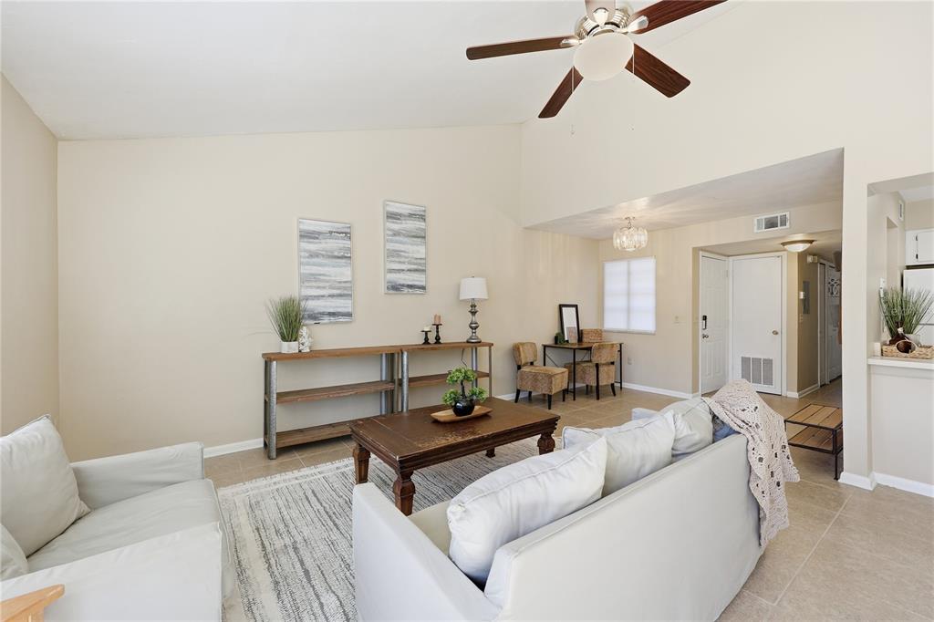 4427 Southwest 21st Lane Gainesville, FL 32607 - Photo 12 of 36 a living room with furniture and a window
