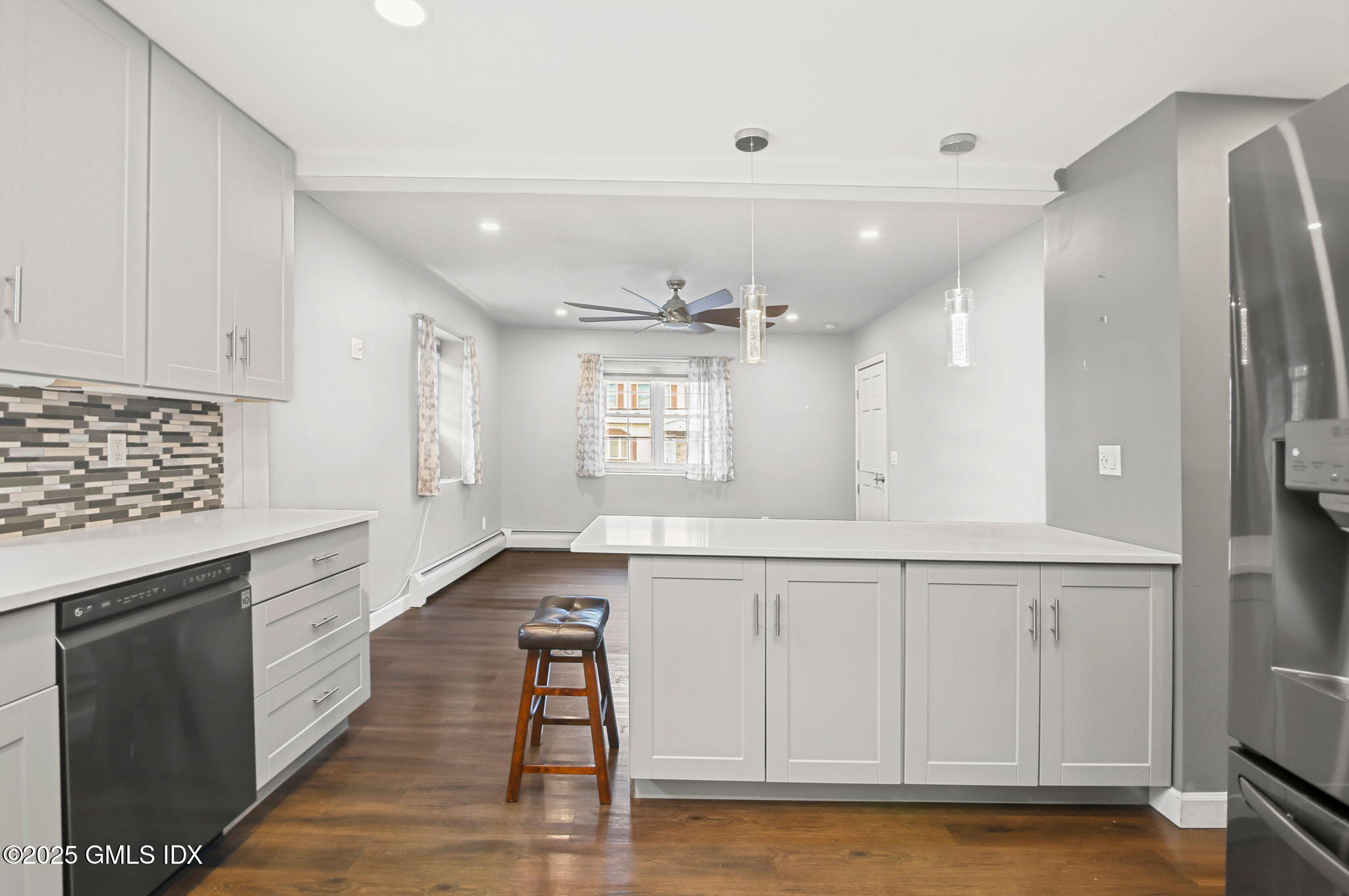 43 Cos Cob Avenue, Unit 1 Cos Cob, CT 06807 - Photo 3 of 10 a kitchen with white cabinets and sink