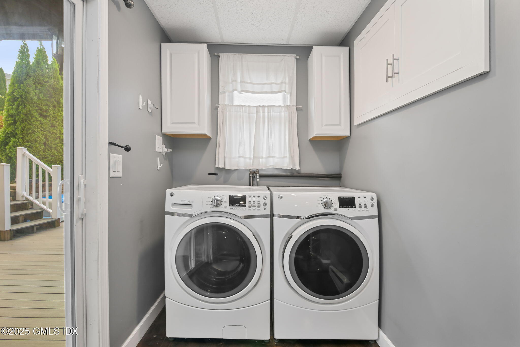 43 Cos Cob Avenue, Unit 1 Cos Cob, CT 06807 - Photo 5 of 10 a utility room with dryer and washer