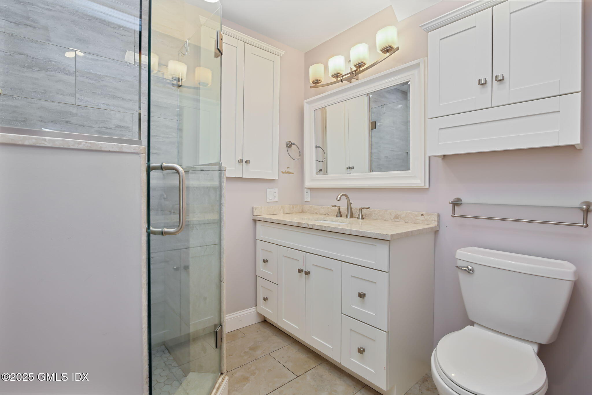 43 Cos Cob Avenue, Unit 1 Cos Cob, CT 06807 - Photo 7 of 10 a bathroom with a toilet sink and shower