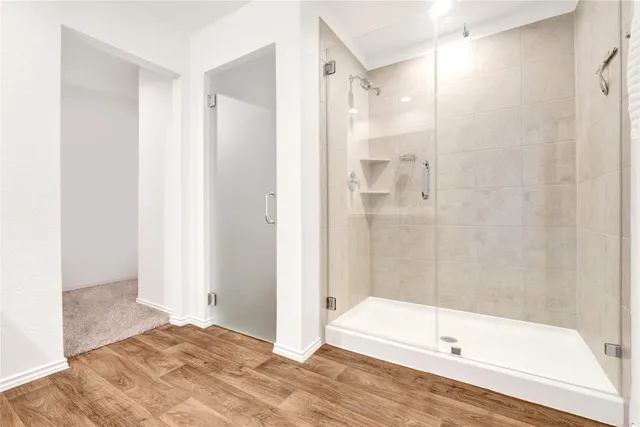 a bathroom with a bathtub and a shower