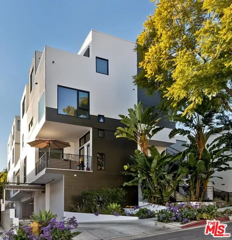 a front view of a house with yard