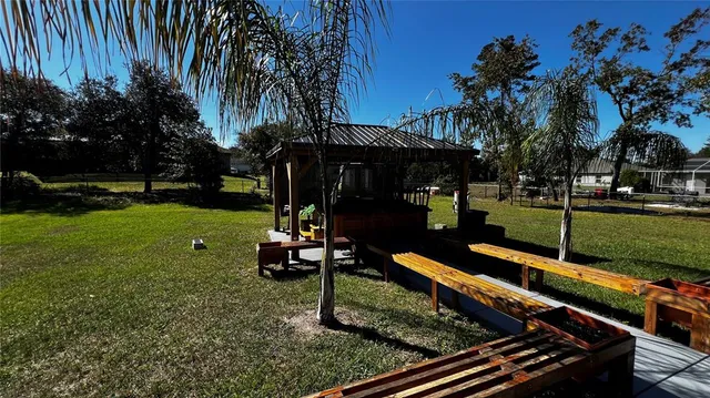 a view of a park with sitting area