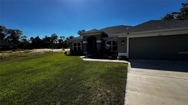 a view of a house with a yard