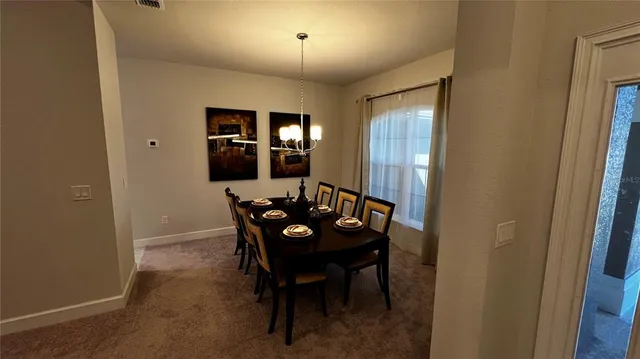 a view of a livingroom with furniture and window