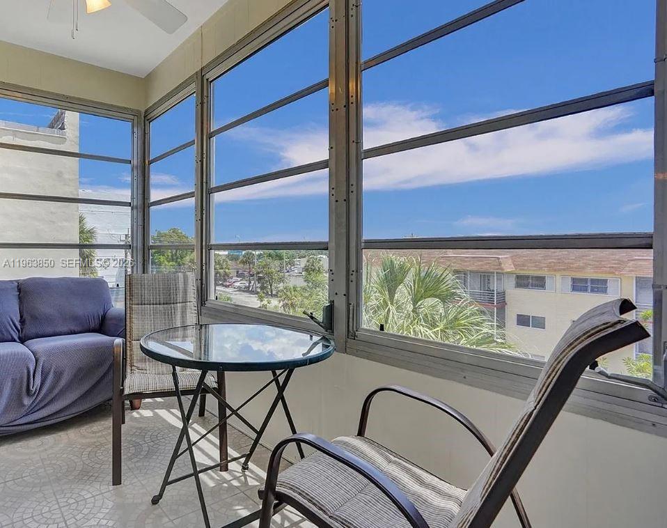 4047 Northwest 16th Street, Unit 403 Lauderhill, FL 33313 - Photo 15 of 22 a view of a balcony with furniture and a window