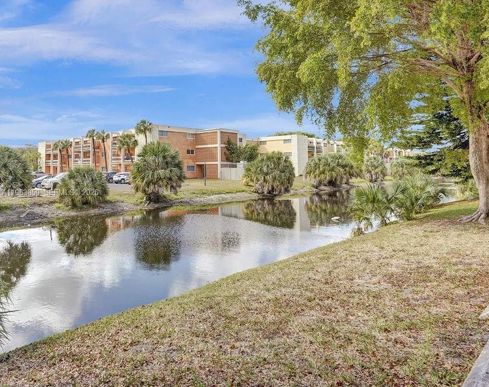 4047 Northwest 16th Street, Unit 403 Lauderhill, FL 33313 - Photo 18 of 22 a view of a lake with houses