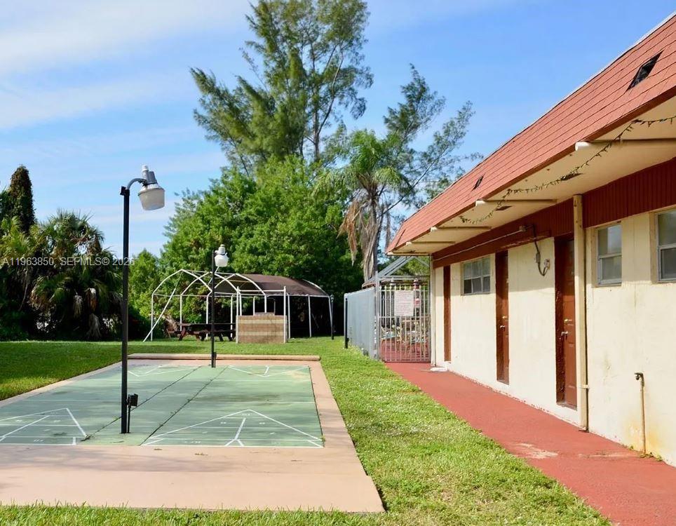 4047 Northwest 16th Street, Unit 403 Lauderhill, FL 33313 - Photo 22 of 22 a view of a house with a yard