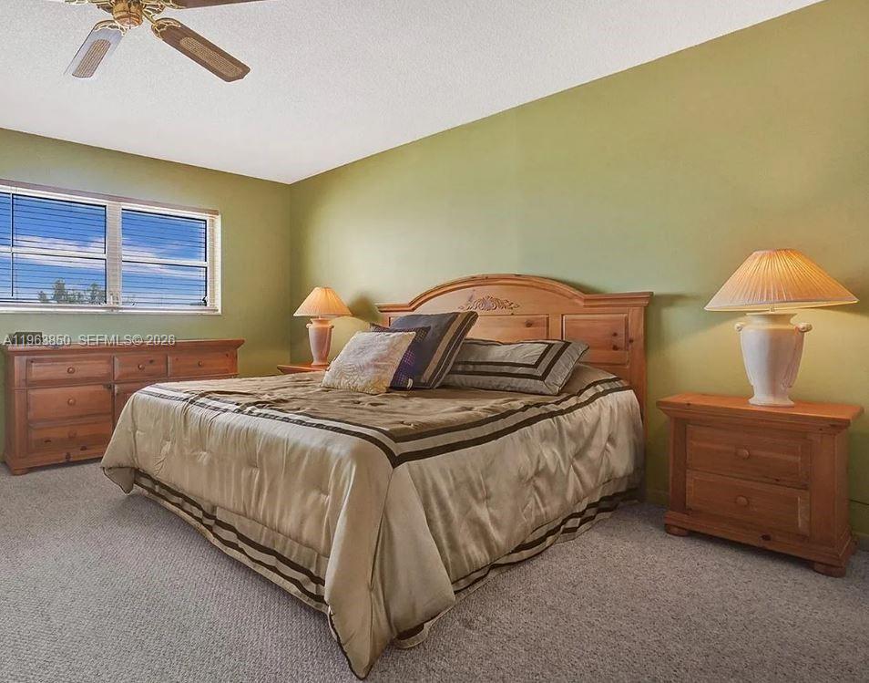 4047 Northwest 16th Street, Unit 403 Lauderhill, FL 33313 - Photo 3 of 22 a bedroom with a bed and window