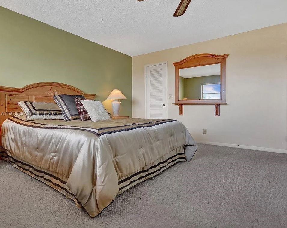 4047 Northwest 16th Street, Unit 403 Lauderhill, FL 33313 - Photo 4 of 22 a bedroom with a bed and window