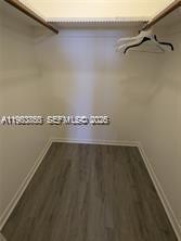 4047 Northwest 16th Street, Unit 403 Lauderhill, FL 33313 - Photo 6 of 22 a view of a room with racks on the wall