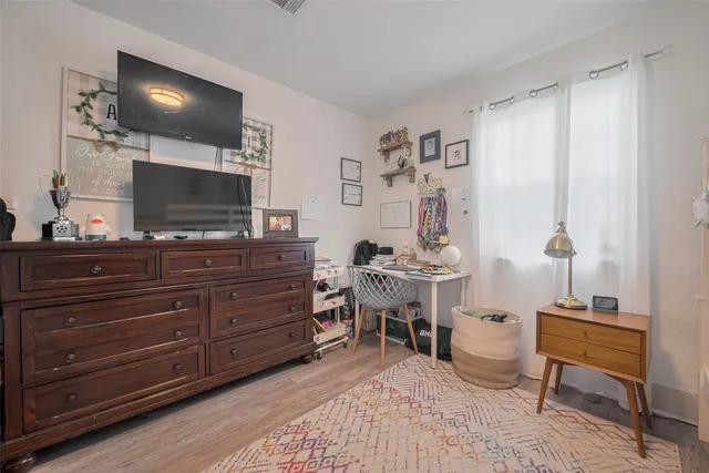 a room with a bed and furniture