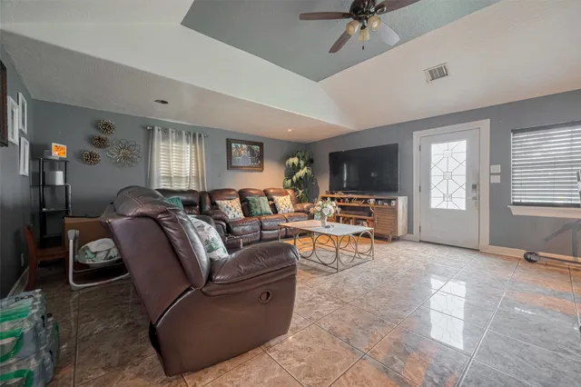 a living room with furniture and a window