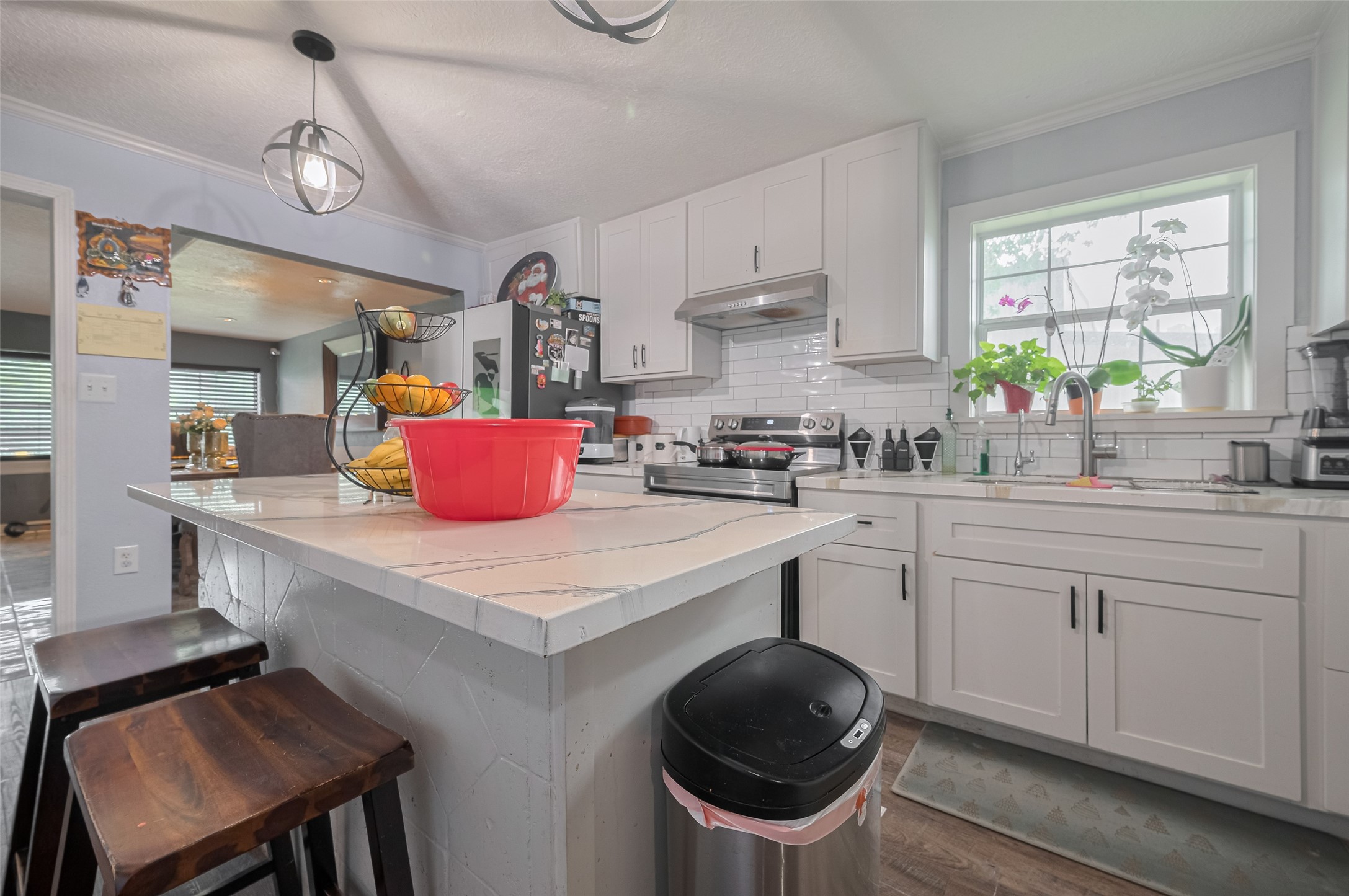 1540 Sheffield Boulevard Houston, TX 77015 - Photo 19 of 42 a kitchen with a stove a sink and cabinets