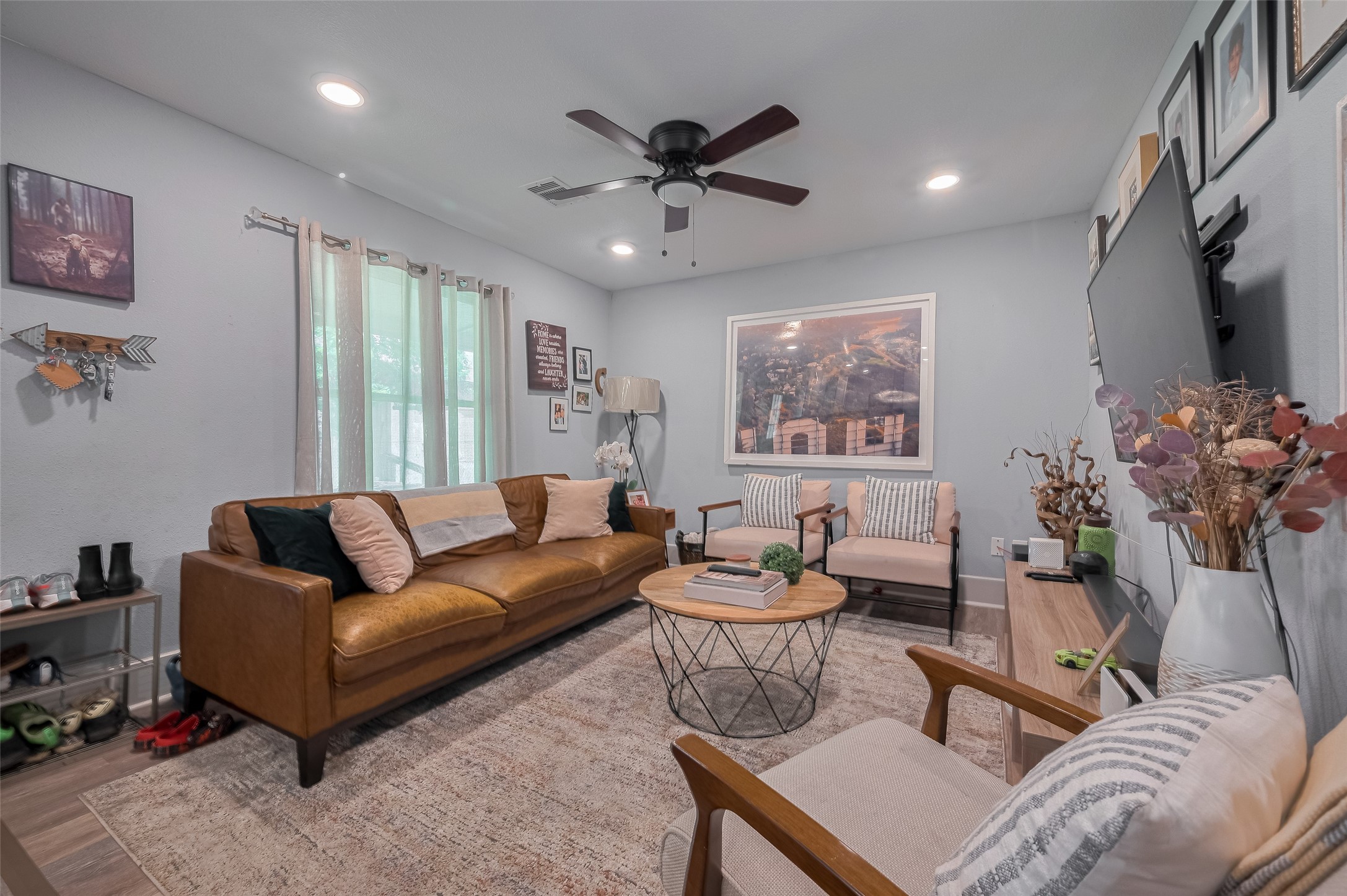 1540 Sheffield Boulevard Houston, TX 77015 - Photo 2 of 42 a living room with furniture a chandelier and a window
