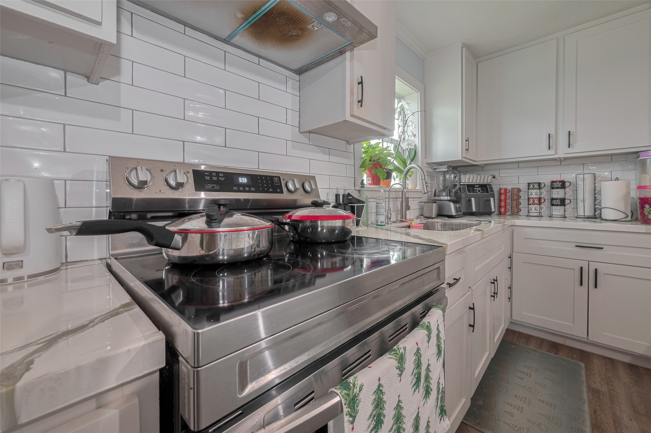 1540 Sheffield Boulevard Houston, TX 77015 - Photo 21 of 42 a kitchen with stainless steel appliances granite countertop a sink dishwasher stove and cabinets