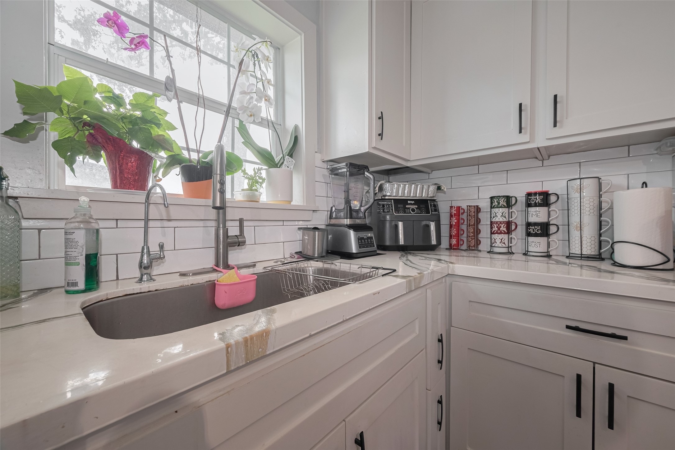 1540 Sheffield Boulevard Houston, TX 77015 - Photo 22 of 42 a kitchen with stainless steel appliances granite countertop a sink a window and cabinets