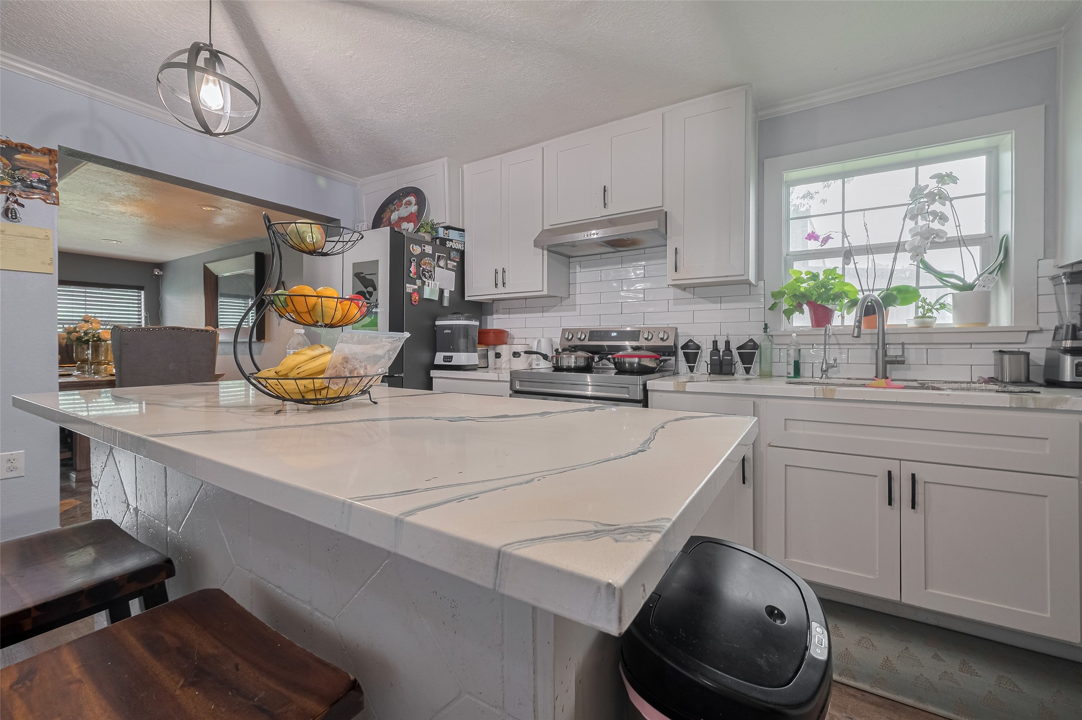 1540 Sheffield Boulevard Houston, TX 77015 - Photo 24 of 42 a kitchen with a sink a stove and cabinets