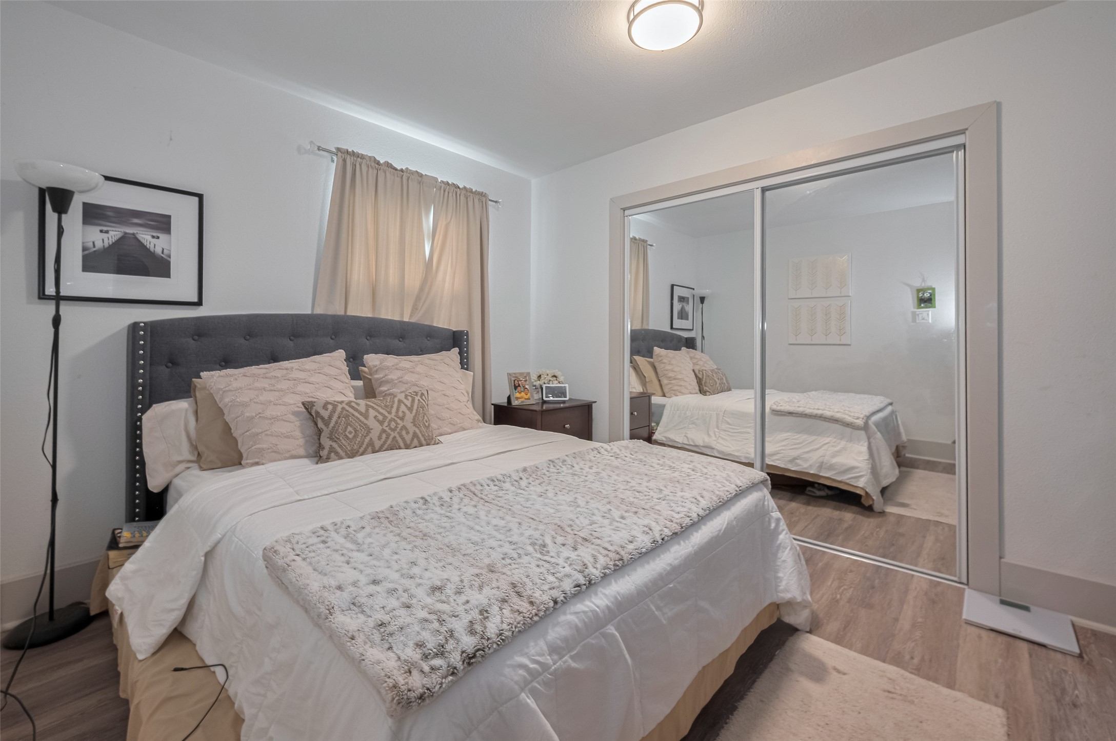 1540 Sheffield Boulevard Houston, TX 77015 - Photo 8 of 42 a bedroom with a bed and a large mirror